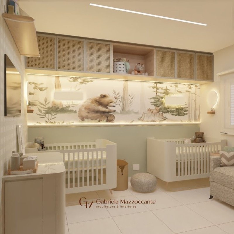 Vista geral de quarto infantil com berços, cômoda e poltrona de amamentação