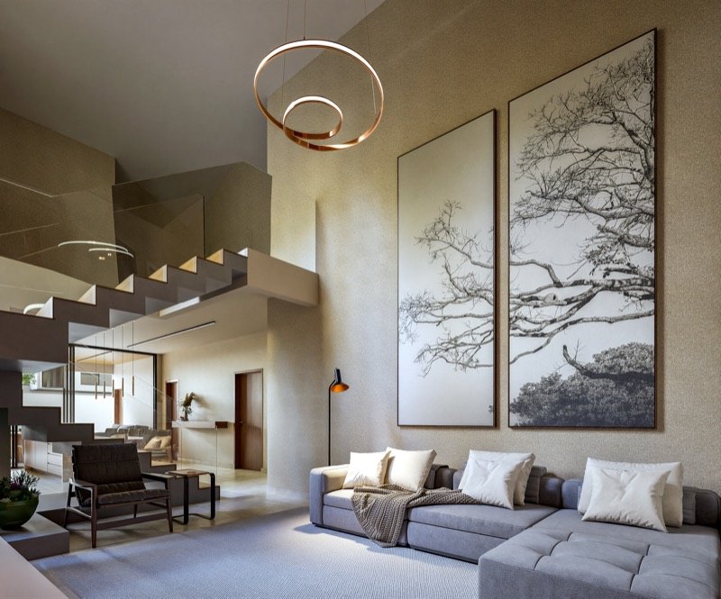 Sala de estar com pé-direito duplo e luminária circular em cobre em residência de alto padrão